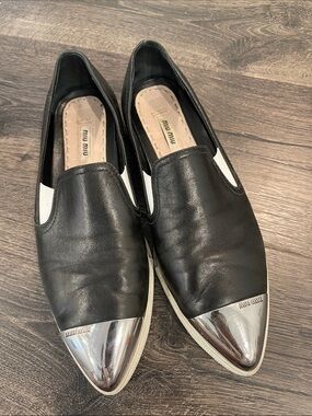 Miu Miu Black Leather Slip-Ons with Silver Cap Toe